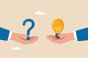Question and answer, solving problem or business solution, ask for reply or idea to solve difficulty and trouble, FAQ concept, businessman hand holding question mark with other reply with lightbulb
